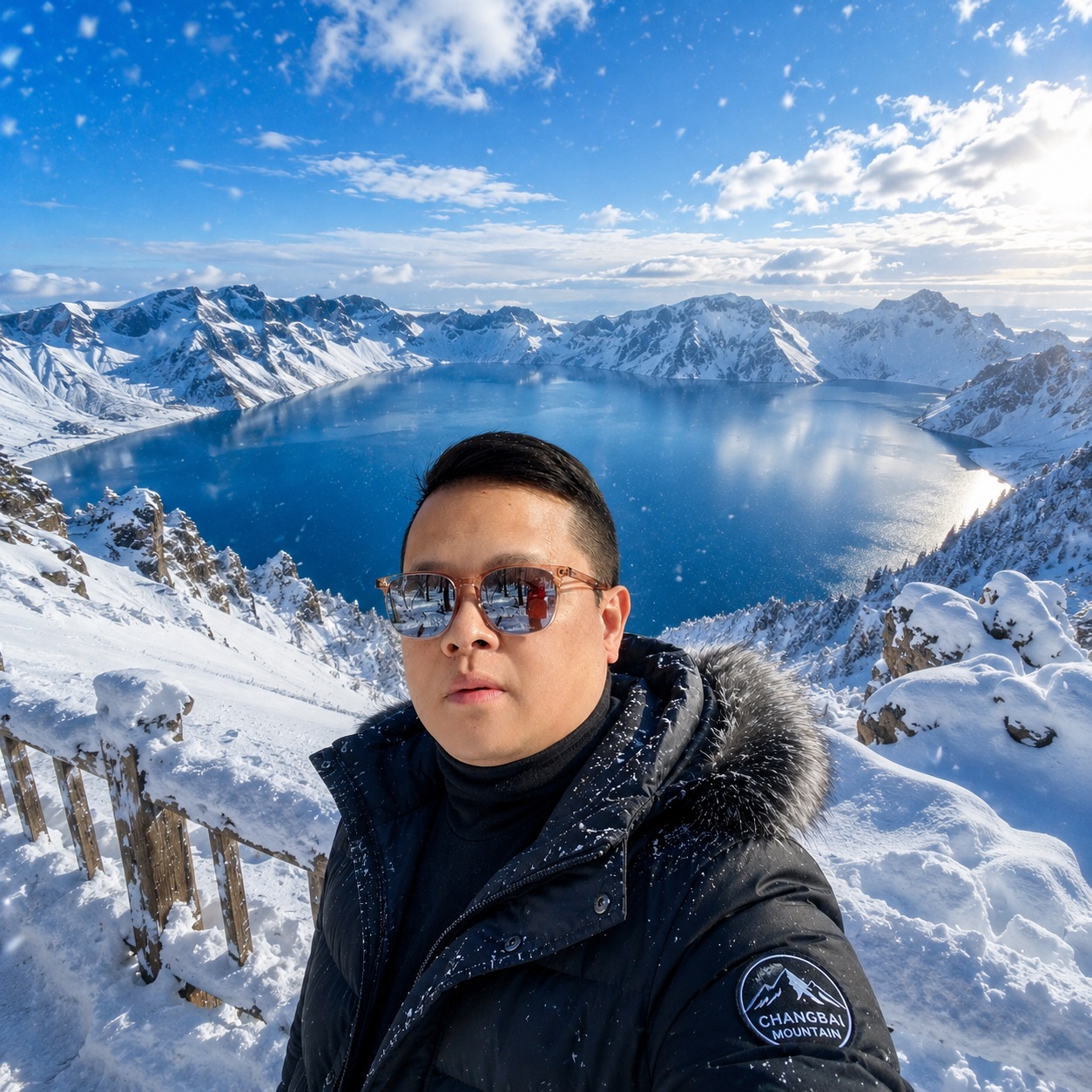 Alex overlooking a snow-covered volcanic lake